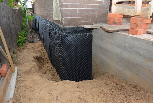 SJ Waterproofing Pros technician performing targeted Emergency Waterproofing assessment in Alpine, NJ